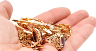 Gold ornaments in a hand