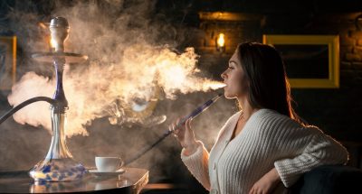 young-woman-vaping-from-hookah-bar_23-2149194234