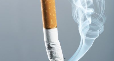 cigarette-butt-with-smoke-toned-image_266732-26389