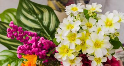 colorful-artificial-flowers-wooden-desk_23-2147925582