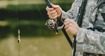 man-fishing-holds-angling-rod_1157-38057