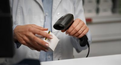 female-pharmacist-scanning-medicine-counter_23-2150359110