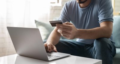 man-using-his-credit-card-play-online-order