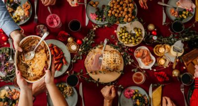 Typical swedish scandinavian christmas smörgåsbord buffet food Photo taken from above overhead table top shot Photot of typical smorgasbord with breaded ham, meatballs, sausauge,noisette, pickled herring and side dishes Julbord med griljerad skinka sill och lax