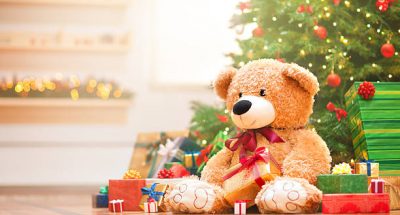 Christmas gifts under christmas tree in the sunny morning.