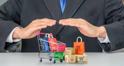 Consumer rights and consumer protection, business law concept : Buyer protects bags and boxes of goods purchased online from internet retailer's website, depicting the protection of items purchased.